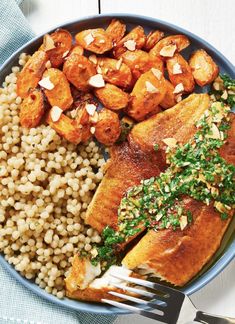 a blue plate topped with chicken, rice and sweet potato salad next to a fork