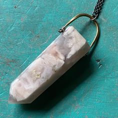 I recently sourced some beautiful crystals and stones so that we could make some more unique Taliswoman necklaces!This listing is for a lovely Cherry Blossom Agate, measuring 2 1/8" tall and 3/4" wide at the top of the stone, suspended from a brass bail with a 20" Sterling Silver chain. Cherry Blossom Agate is the stone of dreamers! If you are a person who is goal driven and has high hopes from life, then a Cherry Blossom Agate will keep you striving after them constantly! The rock is known to n Manifest Them, Cherry Blossom Agate, Beautiful Crystals, High Hopes, Business Career, Feminine Energy, Sterling Silver Chain, Sterling Silver Chains, Old And New