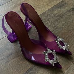 An Italian-Made Pump For The Most Glam Of Cinderellas Gets Its Ethereal Look From A Clear Upper Crowned With An Opulent Jeweled Ring. Amina Muaddi's Kick-Flare Heel Is The Signature Finish. Purple Slingback Pumps With Heel Strap For Party, Chic Purple Slingback Pumps For Formal Occasions, Chic Purple Slingback Pumps For Formal Events, Purple High Heel Slingback Pumps For Party, Purple Slingback Pumps For Party, Purple Slingback Heels For Formal Occasions, Elegant Purple Slingback Pumps, Elegant Purple Slingback Heels, Muaddi Shoes