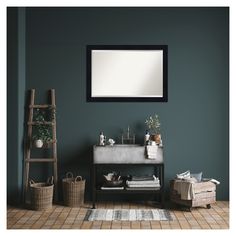 a bathroom with green walls and a mirror