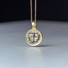 Delphi coin necklace, ancient greek disc pendant. -Oxidized silver set in 9k, 14k or 18k yellow, rose or white gold. -The pendant measures 1.5 cm/0.6 inches. You can buy the pendant with a chain or without a chain. It will be a 9k solid gold chain for the 9k pendant, a 14k solid gold chain for the 14k pendant and a 18k solid gold chain for the 18k pendant. Replica of an ancient coin made of 925 oxidized sterling silver set in solid yellow gold The coin is a replica of the 5th century BC Delphi c Yellow Gold Coin Pendant Necklace In Sterling Silver, Amulet Style Yellow Gold Sterling Silver Coin Necklace, Amulet Sterling Silver Coin Necklace In Yellow Gold, Sterling Silver Amulet-style Coin Necklace, Sterling Silver Amulet Coin Necklace, Tarnish Resistant, Tarnish Resistant Sterling Silver Coin Amulet Necklace, Byzantine Coin Pendant Jewelry, Byzantine Round Coin Pendant Jewelry, Silver Byzantine Jewelry In 14k Gold