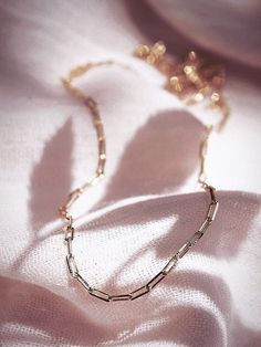 A dainty new classic, the Kala'i Paperclip Chain Necklace is a stunning addition to your collection. Made from 18kt Gold Filled, this popular paper clip style chain is versatile, elegant necklace is a striking statement worn alone or with a bevy of other beauties. ✦ DETAILS ✦ ✧ Name: Kei (KEH ee) - One's pride and glory. ✧ You will receive one necklace. ✧ Links measure 2mm x 5.5mm each. ✧ 18kt Gold Filled with a spring clasp. ✧ All Ke Aloha Jewelry pieces come packaged thoughtfully, beautifully, Minimalist Paperclip Chain Necklace As Gift, Minimalist Paperclip Chain Necklace For Gift, Minimalist Paperclip Chain Necklace Gift, Elegant Everyday Charm Necklaces With Paperclip Chain, Elegant 14k Gold-filled Oval Link Necklaces, Elegant 14k Gold Filled Oval Link Necklace, Classic Necklace With Adjustable Chain As Gift For Her, Elegant Oval Link Charm Necklace For Everyday, Elegant Everyday Charm Necklace With Cable Chain