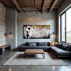 a living room filled with furniture and a painting on the wall above it's coffee table