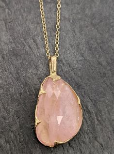 "Fancy cut pink Morganite 18k gold Pendant Gold Necklace gemstone Jewelry byAngeline Morganite feels so soft, gentle and loving. I hand carved this pendant in wax and cast it in solid gold using the lost wax casting process. This one of a kind pendant comes on a solid 18k 18\" chain. The stone measures about 16x25mm. If you don't need a chain for the Pendant please ask about a price reduction to ship w/o chain. Throughout all time and history, in every tribe and culture all around the world crys Handmade 14k Gold Pink Jewelry, Handmade Pink 14k Gold Jewelry, Exquisite 14k Gold Pink Jewelry, Delicate Pink Gold Jewelry With Gemstone, Exquisite Pink 14k Gold Jewelry, Gold Rose Quartz Pendant Jewelry, Gold Pendant With Rose Quartz, Fine Jewelry Gold With Large Stone, Gold Fine Jewelry With Large Stone