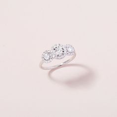 Finally, the ring you’ve always dreamed about. Our engagement rings marry the modern and traditional, taking cues from heirloom shapes and updated with modern design touches. Our signature Perianth™Jewelry Setting enhances the sparkle of our engagement rings, delivering extra sparkly looks without extra cost. Whether you’ve always dreamed of a vintage-inspired ring, or something more modern, our timeless designs are meant to last a lifetime. Each ring is crafted with conflict-free diamonds and s Three Stone Diamond Crystal Ring Fine Jewelry, Fine Jewelry Crystal Ring With Halo Setting And Diamond, Fine Jewelry Crystal Diamond Ring With Halo Setting, White Gold Diamond Crystal Ring With Halo Setting, Fine Jewelry Diamond Crystal Ring With Halo Setting, Elegant Three Stone Crystal Ring, Dazzling Open Cluster Ring With Brilliant Cut, Elegant Crystal Ring With Halo Setting For Promise, White Gold Crystal Ring With Halo In Round Cut