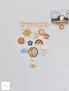 a wall hanging with various items on it next to a clock and other things in the background