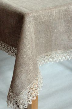 a close up of a table cloth with lace on it