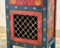 this is an image of a painted cabinet with lattice design on the front and sides