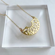 "Powell Gold Plated Pendant on gold Plated Chain. Approx. pendant measurements: 3/4\"L x 1.5\"W. Necklace length: 17.5\"L plus 2\" extender ." Gold Flower Pendant Chain Necklace As Gift, Minimalist Gold Necklace With Large Pendant, Gold-plated Crescent Charm Necklaces, Gold-plated Crescent Charm Necklace, Gold Metal Moon Charm Necklace, Gold Brass Charm Necklace With Large Pendant, Gold Plated Crescent Charm Necklaces, Gold-plated Crescent Necklace, Gold Plated Crescent Charm Necklace