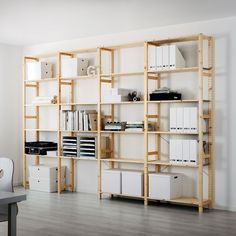 a room with some shelves filled with files