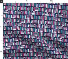 the fabric is colorfully patterned and has stripes on it