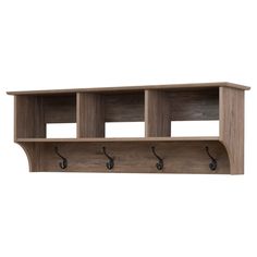 a wooden shelf with three hooks on it