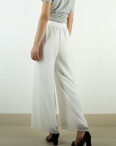 * A wide leg pants with elastic waist, made with beautiful pearl chiffon pants, very comfortable to wear, not easy to get wrinkled, very easy to take care of. * Material: outer-pearl chiffon, lining-100% polyester Custom made to fit, lead time is 6-8 days; Let us know your usual size in your country and your overall height. If you have some specific request or special characters such as broad shoulder, long arms, long waist, etc you think we need pay attention to when making, do let me know. * C Chic Wide Leg Pants With Elastic Waistband, Elegant Wide-leg Culottes With Elastic Waistband, Elegant Wide Leg Culottes With Elastic Waistband, Trendy Summer Wide-leg Harem Pants, Elegant White Wide Leg Pants For Summer, Elegant White Straight Culottes, Versatile Wide Leg Full Length Pants For Spring, Chic Full-length Culottes With Elastic Waistband, Chic Full-length Relaxed Fit Harem Pants