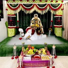 a decorated stage with fruit and decorations on it