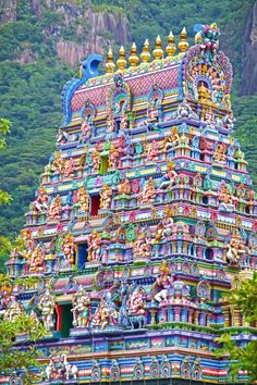 an elaborately decorated hindu temple in the mountains