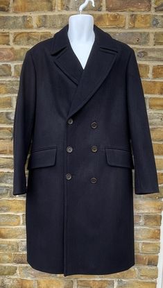 KINGLOUIEVINTAGE   Quality Vintage & British made clothing DESCRIPTION = Vintage 2000's Top quality pure wool blue classic overcoat. Collared neck with notched lapels and six button double breast front opening. Two front flapped pockets (still unstitched) with rear double buttoned belt and single rear buttoned vent.  Outstanding heavy pure wool coat in mint condition.  BRAND = Daks of London SIZE (UK) = 40 CONDITION :- = Excellent, Practically unworn MEASURMENTS (Inches) = ARMPIT - ARMPIT :- 20" 2000s Tops, Made Clothing, Wool Coat, Flap Pocket, Mens Coats, Mens Jackets, Overalls, Bathing Beauties, London