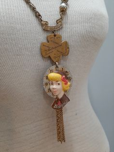 This unique and one of a kind assemblage necklace features various vintage Girl Scout and Brownie pins, along with two different vintage chains and pearls.   The Brownie girl is a 1950s celluloid pin, attached to an antique pocket watch dial.   Necklace length is about 28-30 inches long--slides easily over the head. Vintage Handmade Metal Chain Necklace, Vintage Charm Necklace With Adjustable Chain, Handmade Vintage Metal Chain Necklace, Handmade Vintage Chain Necklace, Vintage Collectible Charm Necklaces, Retro Jewelry With Adjustable Chain, Vintage Handmade Brass Chain Necklace, Handmade Vintage Brass Chain Necklace, Handmade Vintage Charm Necklaces For Jewelry Making