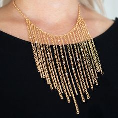 Varying In Length, Mismatched Gold Chains Stream From The Bottom Of A Classic Gold Chain. Faceted Golden Crystal-Like Beads Sporadically Dot The Free-Falling Chains, Creating A Statement-Making Fringe Below The Collar. Features An Adjustable Clasp Closure. Sold As One Individual Necklace. Includes One Pair Of Matching Earrings. Elegant Metal Chain Necklace With Dangling Beads, Elegant Dangle Beaded Chain Necklaces, Elegant Beaded Dangle Necklaces With Chain, Elegant Metal Necklace With Dangling Beads, Gold Bib Necklaces With Beaded Chain For Party, Gold Beaded Chain Bib Necklace For Party, Gold Chain Necklace With Dangling Beads, Gold Bib Necklace With Beaded Chain For Party, Elegant Gold Bib Necklace With Adjustable Chain