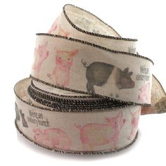 three rolls of ribbon with farm animals on them