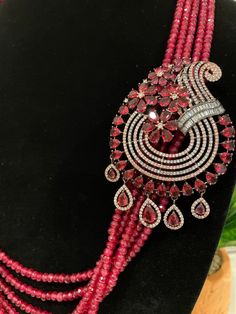 This necklace is a statement piece with a beautiful red/magenta shade and comes with a matching pair of earrings. The length can be adjusted accordingly. Red Ruby Jewelry Sets For Party, Red Party Jewelry With Jewels, Red Long Necklace For Party, Pink Ruby Necklace For Formal Occasions, Round Ruby Necklace For Party, Elegant Red Jewelry Sets For Party, Red Bridal Necklace For Party, Red Costume Jewelry Necklaces For Party, Formal Pink Ruby Necklace