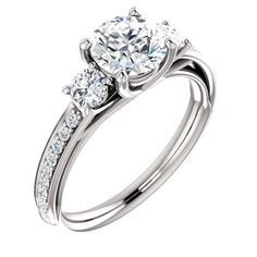 three stone engagement ring with side stones in white gold and diamond set on the band