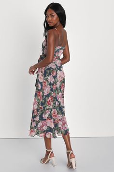 Stroll into the party with confidence, 'cause no on will be able to match your look in the Lulus Delightfully Divine Navy Blue Floral Chiffon Wrap Midi Dress! Airy woven chiffon, with a romantic floral print throughout, falls from adjustable spaghetti straps to form a surplice bodice with long sash ties that thread and secure around the waist. Skirt has an overlapping silhouette and falls to a flirty midi hem. Fit: This garment fits true to size. Length: Mid-calf length. Size medium measures 44.