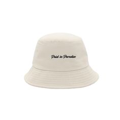 Our Signature Paradise bucket hat is lightweight with a wide brim that helps shield you from the sun's rays. Black embroidered signature logos add elegant contrast on neutral tone. Product Details Signature word mark logo on one side Paradise logo on the other side Fabric is lightweight, four-way stretch, sweat-wicking, and quick-drying Adjustable headband for smaller fit Size Guide Model is wearing size XL Material and Care ▪️ 95% Cotton ▪️ 5% Rayon ▪️ Hand wash cold only ▪️ Do not bleach ▪️ La Beige Summer Hats With Embroidered Logo, Beige Bucket Hat With Uv Protection, Beige Bucket Hat With Uv Protection And Flat Brim, Beige Hat With Embroidered Logo And Short Brim, Summer Wide Brim Hat With Embroidered Logo, Adjustable Wide Brim Bucket Hat With Embroidered Logo, Summer Vacation Hats With Embroidered Logo, Flat Brim Hats With Embroidered Logo For Summer, Summer Hats With Embroidered Logo