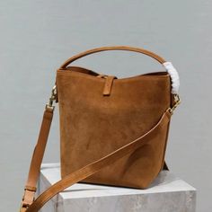 Elevate your style with our New Elegant Suede and Cowhide Bucket Bag! ✨ This sophisticated handbag combines luxury and functionality, making it the perfect accessory for any occasion. Crafted from high-quality suede and cowhide, it features metal feet for added durability and a chic touch. 👜 Key Features: Two Size Options: Small (S): 6.7 x 7.9 x 5.1 inches (17 x 20 x 13 cm) - Ideal for essentials and perfect for a day out. Large (L): 10.2 x 7.9 x 4.7 inches (26 x 20 x 12 cm) - Spacious enough f Work Essentials, Shoulder Handbag, Everyday Bag, Womens Tote, Shoulder Handbags, Halloween Shopping, Bucket Bag, Bags Women, Accessory Gift