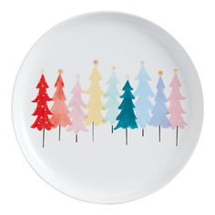 a white plate with colorful trees painted on it