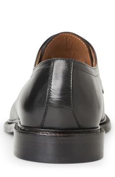 This cap-toe derby is cut from premium Italian leather. Lace-up style Leather upper and lining/leather and rubber sole Made in Italy Classic Cap Toe Lace-up Shoes In Calf Leather, Derby Oxfords With Almond Toe And Leather Lining, Classic Calf Leather Cap Toe Lace-up Shoes, Almond Toe Oxfords With Leather Lining For Derby, Black Calf Leather Oxfords For Derby, Bridle Leather Cap Toe Oxfords With Leather Sole, Timeless Cap Toe Dress Shoes For Derby, Black Derby With Leather Sole In Calf Leather, Black Derby With Calf Leather And Leather Sole