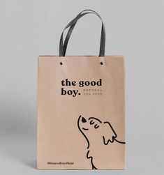 a brown bag with the words, the good boy on it and a dog's head