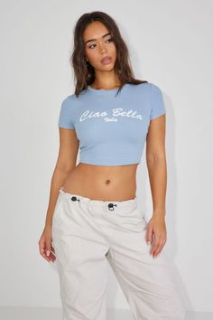 Stormi Tee, Ashley Blue with "Ciao Bella" Art Basic Ribbed Cropped T-shirt For Summer, Casual Stretch Cropped T-shirt, Casual Cropped Seamless T-shirt, Fitted Casual Cropped T-shirt With Crew Neck, Sporty Fitted Top With Ribbed Neckline, Trendy Fitted T-shirt With Ribbed Neckline, Seamless Fitted Cropped T-shirt For Summer, Fitted Ribbed Basic Cropped T-shirt, Fitted Ribbed Cropped T-shirt Basic Style