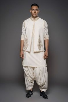 Ivory bundi featuring golden threadwork floral mughal motifs. Comes with matching threadwork kurta, dhoti and foil printed stole. - Aza Fashions Mughal Motifs, Collar Kurta, Kurta Set Men, Rohit Bal, Nehru Jacket, Silk Kurta, Nehru Jackets, Kurta Set, Foil Print