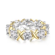 a yellow and white gold ring with three diamonds on it's sides, set in 18k two - tone gold