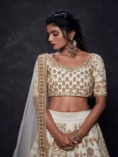 Ivory Luster Multipanel Lehenga With Zardosi And Sequence Work And Net Dupatta (Set of 3) Fabric details: Lehenga - Raw Silk Blouse - Raw Silk Dupatta - Net Embroidery: Lehenga - Zardosi And Sequence Work Blouse - Zardosi And Sequence Work Dupatta - Zardosi And Sequence Work Wash Care Instructions: Dry clean only Note: This product is made to order. No returns The product will be shipped within 4-6 weeks of the order placed Gold Bridal Lehenga, Ivory Lehenga, Embroidered Bridal Lehenga, Gold Lehenga, Choli Blouse, Indian Outfits Lehenga, Punjabi Outfits, Add Sleeves, Net Dupatta