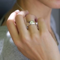 "A simple yet stylish statement jewelry ring bringing Garnet as an accent. This handcrafted Garnet Sterling silver ring will be a pretty piece to accessorize both casual and formal looks. A custom ring you can add to your everyday staples or wrap as a lovely gift for someone dear to your heart. Product Details: ---------------------------------------------------------------- *Ring Size: Please select from the drop-down menu. *Ring width: 0.284\"/ 8.5mm *Stone Diameter: 1.57\"/4mm 💕For matching Modern Stackable Open Birthstone Ring, Modern Open Ring Birthstone Ring With Gemstone, Modern Birthstone Ring With Open Ring Shape, Modern Sterling Silver Birthstone Ring For Everyday, Modern Open Ring Birthstone Ring, Modern Stackable Rings With Tension Setting For Gift, Modern Stackable Rings With Tension Setting As Gift, Modern Birthstone Ring As Gift, Modern Wide Band Ring As Gift