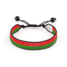 This adjustable handmade bracelet celebrates Madagascar heritage. Crafted from colorful beads in the iconic pattern of the Madagascar flag, this bracelet makes a bold yet understated style statement. An adjustable cord allows it to fit wrists of different sizes so it can be shared or worn year-round. Lightweight and versatile, it pairs well with casual or dressy outfits for a pop of color. Wear it to show your Malagasy pride or as a conversation starter to share your cultural background. The intricate beading is done by hand, so each piece has its own unique texture and charm.    Exported By ExportYourStore :) Adjustable Multicolor Braided Bracelets With Round Beads, Green Beaded Bracelets With Adjustable Length, Casual Multicolor Adjustable Bracelets, Multicolor Adjustable Friendship Bracelets With Round Beads, Adjustable Multicolor Casual Bracelets, Green Adjustable Bracelets For Festivals, Adjustable Jubilee Beaded Bracelets For Friendship, Casual Adjustable Multicolor Bracelets, Multicolor Bracelets With Adjustable Round Beads