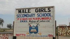 a sign for male girls secondary school in the desert