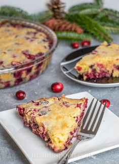 a slice of cranberry cheesecake on a plate with a fork next to it