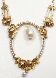 ANTIQUE ART NOUVEAU FRESHWATER AND NATURAL PEARL LAVALIER NECKLACE {International Buyers Are Responsible For Customs & Duty Fees} Circa ~ 1900'S ~ Freshwater Pearl ~  Measurements ~ 8.95 MM - 0.352 Inches x 5.71 MM - 0.2245 Inches x 5.34 MM - 0.210 Inches Color ~ White 23 ~ Round Natural Pearls Color ~ White/Light Grey Size ~ 1.64 MM - 0.064 Inches 1 ~ Round Natural Pearl  Color ~ White/Light Grey Size ~ 3.00 MM - 0.118 Inches Measurement Of Oval Section (North To South) ~ 3892 MM - 1.532 Inches (East To West) Width ~ 27.13 MM - 1.068 Inches Measurement Of Each Gold Floral Link ~ 18.64 MM - 0.734 Inches x 7.89 MM - 0.3105 Inches Thickness Of Oval Floral Section ~ 3.06 MM - 0.1205 Inches Length Of Necklace ~ 17 Inches Thickness Of Chain ~ 1.13 MM - 0.0445 Inches Metal ~ 18K Yellow Solid Gol Gold Oval Jewelry With Historical Design, Victorian Evening Necklace With Hallmark, Vintage Yellow Gold Necklace For Ceremonial Use, Vintage Yellow Gold Necklace For Ceremonial Occasions, Baroque Pearl Pendant Necklace For Formal Occasions, Gold Oval Jewelry For Opera, Victorian Hallmarked Necklace For Evening, Antique Pearl Pendant Necklace For Formal Occasions, Heirloom Gold Jewelry With Historical Design