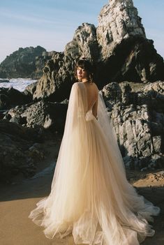 A-line beaded tulle wedding dress with cape sleeves photo 1 Flowing Silk Dress, Wedding Dress Shoulder Cape, Wedding Dress Cape Sleeves, Ethereal Wedding Dress Goddesses, Wedding Dress With Cape Sleeves, Wedding Gown With Cape, Wedding Dress Cape, Wedding Dress With Cape, Dress With Cape Sleeves