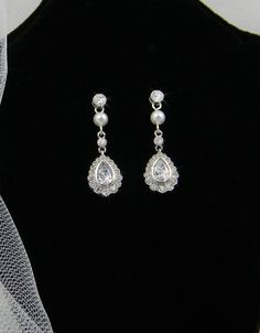 . Classic Silver Chandelier Earrings For Wedding, Sterling Silver Teardrop Clip-on Earrings For Wedding, Elegant Silver Wedding Earrings, Elegant Drop Earrings For Bridal Wedding, Silver Dangle Bridal Earrings For Wedding, Silver Wedding Earrings With Elegant Design, Pearl Drop Dangle Clip-on Earrings For Wedding, Dainty Pearl Drop Chandelier Earrings For Wedding, Dainty Sterling Silver Pearl Earrings For Wedding