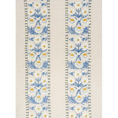 an embroidered white and blue wallpaper with flowers on the border, in front of a white background