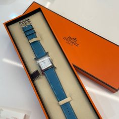 Gently Used Authentic Hermes Watch. Comes In Original Box With Original Orange Bracelet Straps. I Just Changed The Battery And Bought A New Blue Strap From Hermes. You Will Receive The Watch, Hermes Box, Hermes Booklets That Came With The Watch, And The Extra Original Orange Straps. Case: Stainless Steel, 21 X 21 Mm Antiglare Sapphire Crystal Water-Resistant To 30 M Dial: Stainless Steel Movement: Quartz, Made In Switzerland Functions: Hours, Minutes Bracelet: Etoupe Calfskin, Interchangeable, S Timeless Blue Rectangular Watch, Blue Rectangular Timeless Watch, Blue Rectangular Business Watches, Classic Blue Rectangular Watch Accessories, Elegant Blue Watch Accessories For Gift, Elegant Blue Watch Accessories As Gift, Elegant Blue Watch With Leather Strap, Rectangular Blue Quartz Watches, Elegant Blue Watch With Bracelet Strap