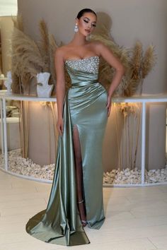 Feel beautiful and glamorous in this fashionable and eye-catching evening dress. This column dress features delicate beading and a satin finish, perfect for any special occasion. The sleeveless design will make you look and feel chic, showing off your natural beauty. Make a statement with this timeless design. Prom Dress Strapless, Sleeveless Prom Dress, Prom Dress Mermaid, Split Prom Dresses, Strapless Prom Dress, Dusty Sage, Homecoming Party, Strapless Prom Dresses, Dress Mermaid