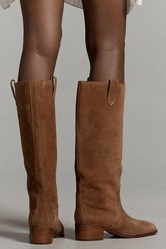 We're kicking up lust over the new Western boot trend. The Lola Cruz Cala Boots feature a knee-high silhouette with side-pull tabs and a classic Western design. | Cala Knee-High Western Boots by Lola Cruz in Brown, Women's, Size: 37, Rubber/Suede at Anthropologie Brown Boots Suede, Lola Cruz Boots, Brown Boots Tall, Closet Rebuild, Best Shoes For Women, Sherling Boots, Wide Calf Boots For Women, Wide Calf Cowgirl Boots, Tall Tan Boots