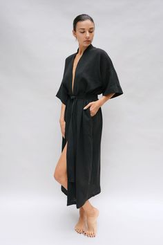 Inspired by our founders' first trip to Bali, the Bali Robe embodies our "bedroom to beach" concept. Crafted from lightweight fabric with a captivating texture reminiscent of rippled water. This versatile robe transitions seamlessly from home attire to beach cover-up, becoming a staple in your daily wardrobe. Drop Sleeve Relaxed fit Midi length Tie waist belt Pockets Rippled Water, Trip To Bali, Linen Robe, Natural Detergent, Drop Sleeve, Plant Dyes, Womens Robes, Dyeing Process, Black Hand