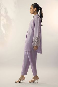 A refreshing lilac shade on a raw silk kurta, is adorned with embroidery on the sleeves and pearl buttons. Pair it with a co-ord trouser. Classy, elegant and summer ready. Elegant Embroidered Salwar Kameez With Straight Pants, Elegant Sets With Set-in Sleeves And Straight Pants, Spring Wedding Cotton Silk Bandhgala, Bollywood Style Straight Kurta Set With Embroidered Sleeves, Designer Spring Kurta With Set-in Sleeves, Designer Wear Spring Kurta With Set-in Sleeves, Elegant Straight Kurta With Set-in Sleeves, Spring Cotton Bandhgala With Dabka, Elegant Salwar Kameez With Straight Pants For Eid