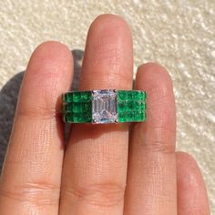 Emerald ring featuring semi precious green stone and cz diamonds in an invisible setting. Ideal to pair with your formals to special occasion outfits. Perfect Gift for her. *𝐏𝐑𝐎𝐃𝐔𝐂𝐓 𝐃𝐄𝐓𝐀𝐈𝐋* * 𝐌𝐚𝐭𝐞𝐫𝐢𝐚𝐥: Brass * 𝐏𝐥𝐚𝐭𝐢𝐧𝐠: White Rhodium Plated * 𝐒𝐭𝐨𝐧𝐞: AAA-quality CZ Diamond & Emerald. *𝐃𝐈𝐌𝐄𝐍𝐒𝐈𝐎𝐍𝐒* * 𝐖𝐞𝐢𝐠𝐡𝐭: 6 gm * 𝐖𝐢𝐝𝐭𝐡: 0.8 Inch * 𝐒𝐢𝐳𝐞: 5.5  fits upto 6 𝐕𝐢𝐬𝐢𝐭 𝐎𝐮𝐫 𝐅𝐀𝐐𝐬 𝐟𝐨𝐫 𝐒𝐡𝐢𝐩𝐩𝐢𝐧𝐠 𝐏𝐨𝐥𝐢𝐜𝐢𝐞𝐬 𝐚𝐧𝐝 𝐂𝐚𝐫𝐞 𝐈𝐧 Ring Bride, Emerald Band Ring, Bride Wedding Gift, Luxury Green, Emerald Band, Ring Luxury, Wide Band Ring, Emerald Diamond Ring, Wedding Gifts For Bride