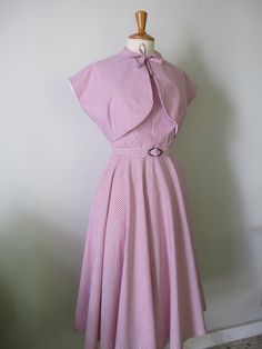 This 1950s style one-piece dress is made out of cotton fabric available in various fabric options! It features a halter bodice with an open back, peter pan collar with a front bow tie, circle skirt, and matching belt.(i use vintage buckles so they may be different from the ones in the pics) . Zips up the back with a hidden zipper a hook and an eye on the top. The bodice is fully lined with cotton lining! Available in all sizes. Pm me before you buy! I will need measurements for bust, waist, and Classic Summer Dress With Striped Collar, Classic Summer Dress With Peter Pan Collar, Classic Striped Summer Dress, 1950's Dress, Circle Skirt Dress, 1950s Style, Dress Halter, 1950s Dress, 1950s Fashion